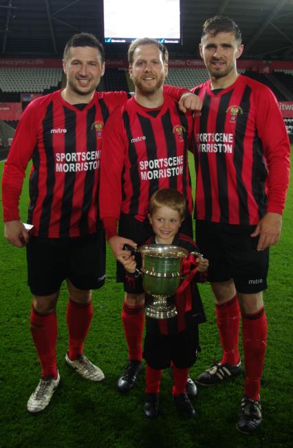 Goodwick United skipper Adam Raymond, goal scorer Lee Hudgell, and son, and player manager Wayne OSullivan